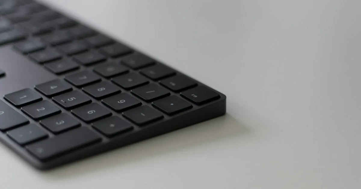 Close-up of a keyboard resting flat on a desk - KeyRiser