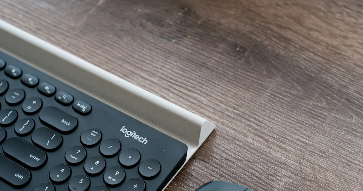 Logitech MX Keys full-size wireless keyboard on a desk, the model you identify before choosing a riser